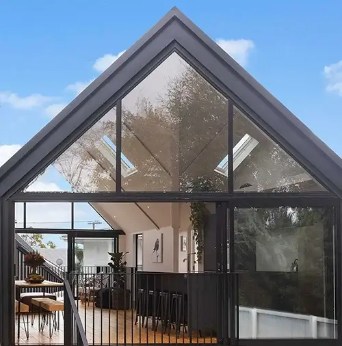 Black metal house with large glass windows