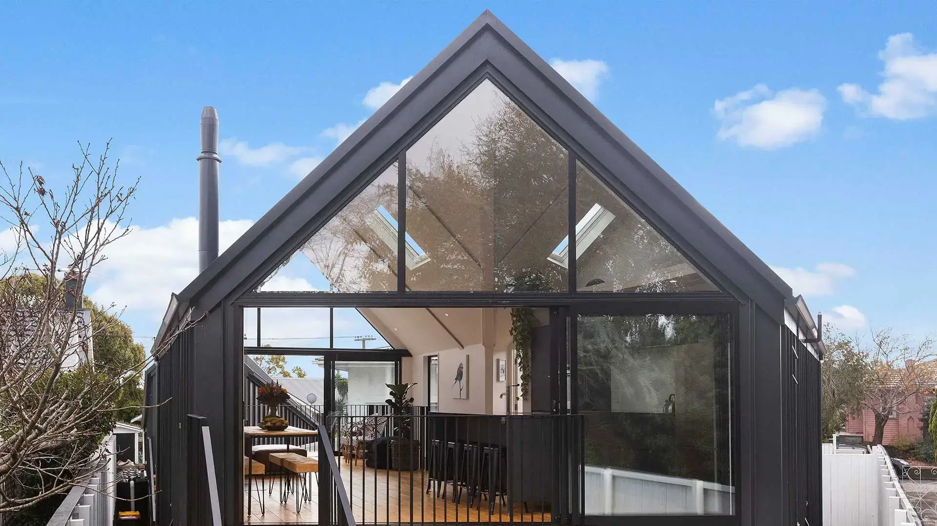 Black metal house with large glass windows